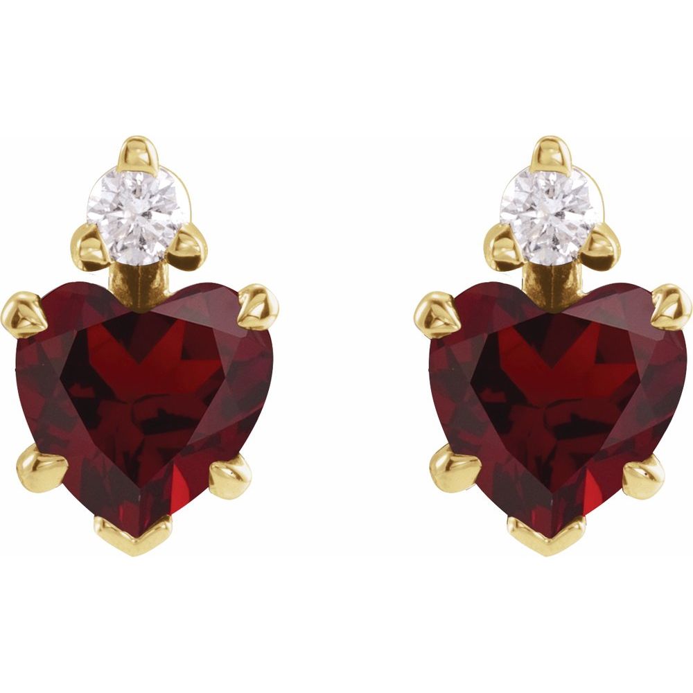 Heart-shaped red gemstone earrings with gold accents on a white background