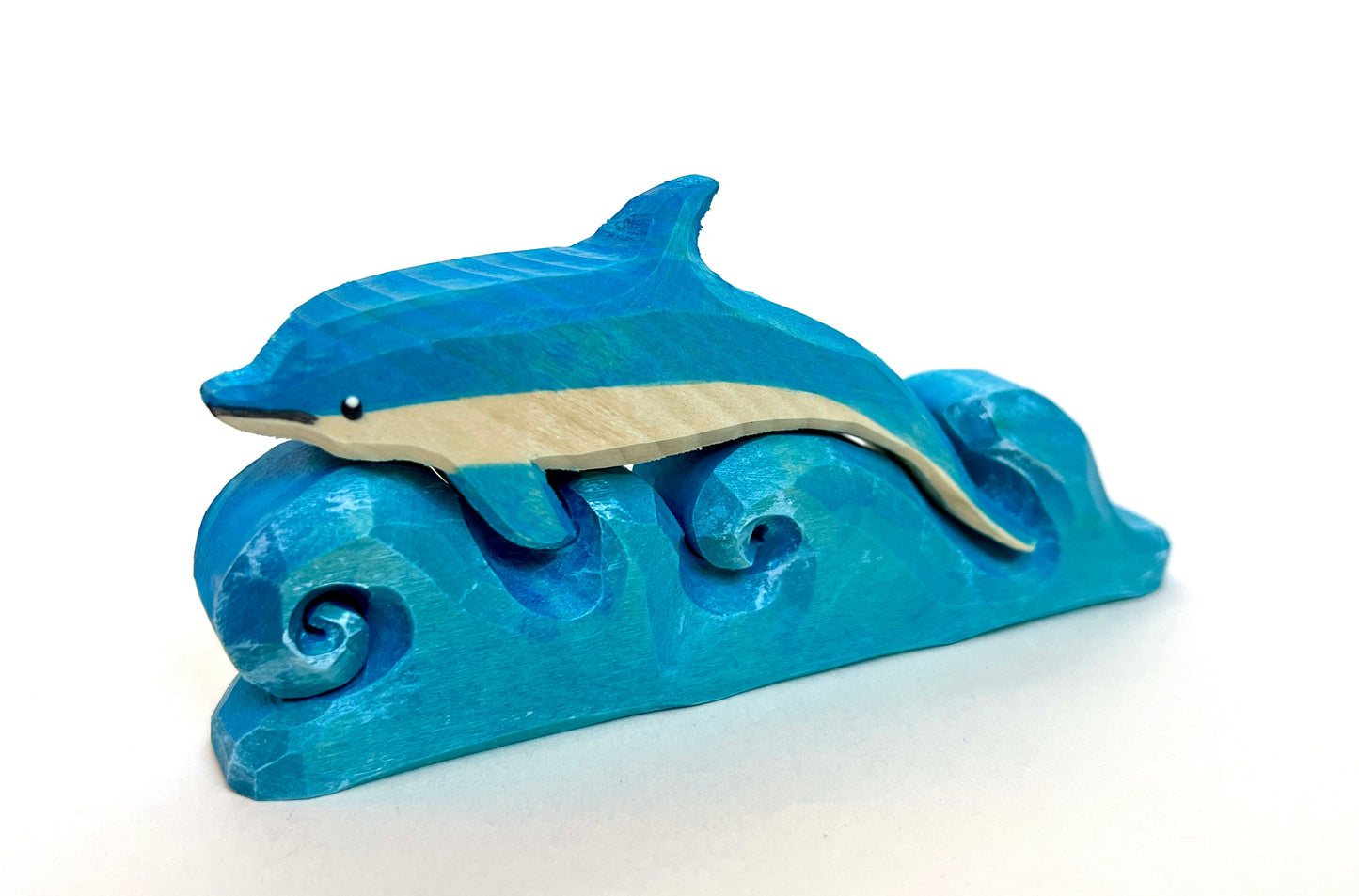 Wooden Dolphin on Waves